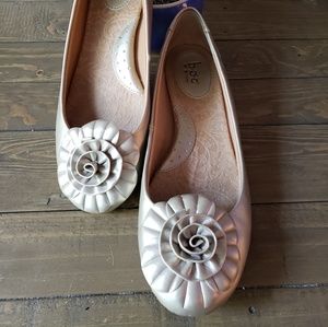 Born boc Emalia Gold flats with floral detail.